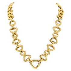 Introducing the David Webb 18K Yellow Gold Long Chain Link Necklace, a masterpiece of timeless elegance and versatility. Crafted with meticulous attention to detail, this exquisite necklace features a series of hammered and high-polished chain links, each ranging from 0.5 to 1 inch wide, creating a luxurious and eye-catching aesthetic. At its longest, the chain measures 24.5 inches, allowing it to gracefully drape along the neckline for a stunning statement look. However, what sets this necklace Elegant Hammered Link Jewelry, Elegant Hammered Link Chain Necklace, Elegant Hammered Link Necklace, Luxury Hammered Jewelry For Formal Occasions, Luxury Yellow Gold Hammered Necklace, Gold Long Chain, David Webb, The David, Chain Links