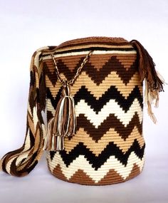 Mochila purse made by artisans of the Wayuu Indigenous Group in Colombia Purchased directly from Artisan, on a Fair Trade Basis Fully Handmade For each Wayuu Mochila Bag purchased, Hands of Colombia donates thread to Indigenous Artisans. Only ONE available Wayuu Mochila Purses are famous for their stunning designs and unique character. Each purse is handmade, full of expression and character. SIZE - Large. 12 inches deep (30.5cm), 13 inches wide (33cm). Comfortably fits large items: use as an ev Mochila Bag, Peruvian Connection, Handmade Purses, Crochet Handbags, Crochet Bag, Fair Trade, Unique Fashion, Fashion Statement, Bucket Bag