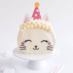 a white cake with a cat face on it