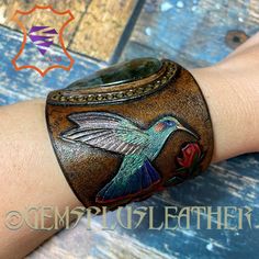 Tooled Leather Hummingbird Bracelet Hand Painted Leather | Etsy Elegant Patina Bracelets As Gift, Unique Hand Tooled Jewelry, Adjustable Patina Jewelry Gift, Artisan Leather Jewelry, Adjustable Elegant Jewelry With Patina Detail, Elegant Adjustable Cuff Bracelet With Patina, Elegant Adjustable Patina Cuff Bracelet, Elegant Adjustable Jewelry With Patina, Elegant Leather Jewelry For Festivals