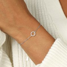 The circle is a unique symbol with a significant meaning, It represents wholeness, eternity, and timelessness, It symbolizes eternal love and endless friendship. There's no limit on how you can interpret it. This special piece will become not only a suitable choice for everyday wear, but also a bold statement when layered with other unexpected combinations. Minimalist Promise Bracelet, Everyday Round Band Bracelets, Minimalist Infinity Jewelry For Promise, Dainty Silver Promise Bracelets, Sterling Silver Jubilee Bracelet For Promise, Dainty Silver Bracelets For Promise, Minimalist Sterling Silver Diamond Bracelet, Timeless Silver Infinity Jewelry, Timeless Infinity Silver Jewelry