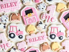 decorated cookies with farm animals and tractors on them