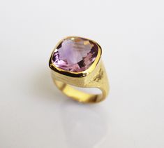 ♦♦ Beautiful handcrafted ring ◘Stone Information: Genuine Amethyst - Color: Purple Cut: Briolette Cushion Size: 15 mm ◘ Metal: 925 Sterling Silver ◘ Band: 4.5 mm textured ◘ Setting: Open back bezel setting ◘ Finish: High polish (shiny) ◘ Nickel free ◘ Anti tarnish ◘ Vermeil Gold ◘ Handmade band: 14 gauge solid sterling wire This ring is adorably rustic, easy to wear, & stackable! ◘Please Note - The Ring in the Picture can be available or Sold out. Every Ring is Made of a Unique Gemstone. The Timeless Amethyst Ring As A Gift, Timeless Amethyst Gemstone Rings, Kunzite Ring Fine Jewelry Gift, Kunzite Gemstone Ring For Gift, Elegant Amethyst Signet Ring Hallmarked, Elegant Amethyst Hallmarked Signet Ring, Elegant Hallmarked Amethyst Signet Ring, Gold Amethyst Ring With Large Stone As Gift, Elegant Amethyst Gemstone Signet Ring