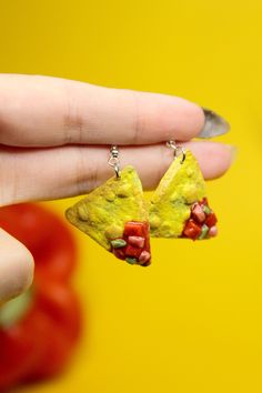 Embrace your love for Mexican food with these adorable salsa and chip dangle earrings. Handcrafted by skilled artisans, these unique pieces of artisan jewelry are designed to delight the foodie in you. Imagine the joy of dining out with friends, savoring your favorite dishes from your go-to restaurant (even if you've enjoyed them countless times before!). Food is more than just sustenance; it's about creating memories, forging connections, and sharing special moments around the dining table. We take pride in hand-making each earring personally, infusing them with care and attention to capture the essence of those joyful dining experiences. Our commitment to quality is unwavering, as we never outsource our products to cheap overseas factories. Feast your eyes on the vibrant and realistic ha Quirky Multicolor Dangle Jewelry, Novelty Polymer Clay Dangle Jewelry, Quirky Handmade Drop Earrings, Quirky Multicolor Jewelry For Gifts, Quirky Dangle Jewelry For Gifts, Quirky Dangle Jewelry Gift, Quirky Dangle Jewelry As A Gift, Handmade Fun Sterling Silver Jewelry, Fun Dangle Jewelry For Crafting