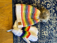 This rainbow hat and mitten set will be sure to bring sunshine to any day! Crafted with super soft fleece-lined fabric, this set is the perfect way to add a splash of color and comfort to your winter wardrobe. Put this on and spread some cheer! Rainbow Clothes, Rainbow Hat, Rainbow Hats, Rainbow Outfit, Splash Of Color, The Sunshine, Winter Wardrobe, Color Splash, Rainbow