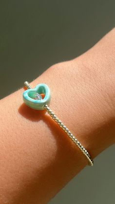 Turquoise Heart  - choose your size  -stretchy bracelet  - This Dainty bracelet is the perfect bracelet to stack with your other bracelets or wear it alone for a minimal look . - handmade with love . Blue Heart Charm Jewelry For Friendship, Friendship Heart Bracelet With Tiny Beads, Heart-shaped Friendship Bracelet With Tiny Beads, Heart Bracelet With Tiny Beads For Gift, Dainty Beaded Bracelets With Heart Beads As Gift, Dainty Beaded Bracelet With Heart Beads For Gift, Dainty Adjustable Heart Shaped Beaded Bracelets, Adjustable Heart-shaped Dainty Beaded Bracelets, Dainty Heart-shaped Adjustable Beaded Bracelets