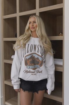 This Yellowstone national park sweatshirt is crafted in a neutral white hue with an oversized, relaxed fit. Wrap yourself in comfortable style and plush warmth no matter where your adventures take you. yellowstone Wyoming national park graphic sweatshirt oversized fit model is wearing a s/m Trendy Mom Outfits Winter, Cardigan Outfit Fall, Yellowstone Sweatshirt, Yellowstone Wyoming, National Park Graphic, Mom Outfits Winter, National Park Sweatshirt, Fits Fall, Trendy Mom Outfits