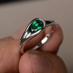 This is a gorgeous handmade creation. Its beauty is its simplicity & Elegance. The 5*7 mm oval shape faceted lab emerald is crafted in solid sterling silver and with rhodium plated. All item is sent in a beautiful gift box If you have any idea of design your ring,pls contact me directly. You can realize more lovely stuff clicking the link https://www.etsy.com/shop/knightjewelry?refshopsection_shophome_leftnav Please leave the correct address and you phone number for delivering successfully. Emerald Oval Cabochon Ring As A Gift, Oval Faceted Birthstone Ring For Anniversary, Teardrop Emerald Ring As Gift, Teardrop Emerald Ring For Gift, Oval Faceted Crystal Promise Ring, Faceted Emerald Promise Ring, Elegant Faceted Round Emerald Ring, Oval Emerald Ring With Polished Finish, Oval Emerald Ring For Gift