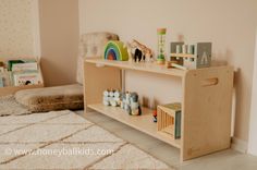 a wooden shelf with toys on it in a child's room