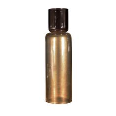 a gold colored glass bottle with a black cap