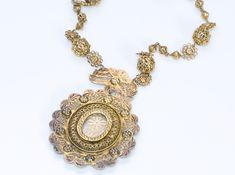 Antique Necklace Pendant. Victorian Spanish silver gilt filigree necklace pendant. Luxury Oval Necklace With Intricate Design, Ornate Baroque Yellow Gold Jewelry, Elegant Oval Filigree Necklace, Ornate Baroque Jewelry With Intricate Design, Victorian Necklace With 17 Jewels In Oval Pendant, Luxury Oval Necklace For Ceremonial Occasions, Oval Large Pendant Necklaces For Wedding, Ornate Silver Baroque Necklaces, Luxury Filigree Medallion Jewelry