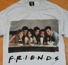 friends t - shirt sitting on top of a wooden table