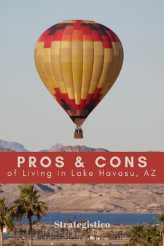 a hot air balloon flying in the sky above palm trees and mountains with text pros & cons of living in lake havanus, arizona