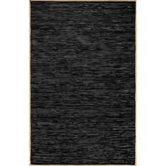 a black area rug with gold trim