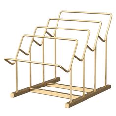 three gold metal racks with handles on each side and one in the middle, against a white background