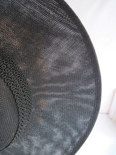 "* This black Sinamay hat form has a 12\" diameter and has a subtle and sophisticated animal print enhanced with the spectator feathered butterflies. The band is a woven braid and coordinates with the subdued hat print. * The hat has been designed to sit on either side of the head with an acrylic headband. * Upon ordering this is the exact hat you will receive. * Perfect to wear to any Special Event or Celebration, Ladies Luncheon, Derby Parties, Weddings, Wedding or Baby Shower, Anniversary, Fa Evening Boater Hat With Short Brim In Sinamay, Vintage Black Brimmed Sun Hat, Wide Brim Sinamay Boater Hat For Evening, Black Boater Hat With Curved Brim For Church, Black Boater Hat With Curved Brim For Evening, Black Sinamay Fascinator For Summer, Black Curved Brim Boater Hat For Church, Black Brimmed Boater Hat For Church, Vintage Black Straw Hat With Flat Brim