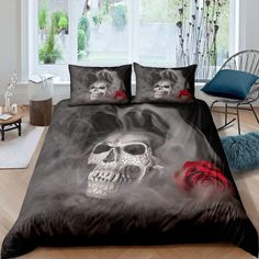 a bed with two skulls and roses on it