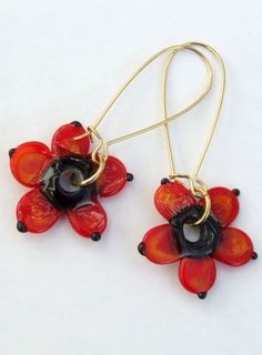 Lampwork Geometric Organic Flower Earrings,  Red Flower Earrings, Fun and Sweet Earrings,  Lampwork Jewelry, Ready to Ship ! A delicate pair of earrings in shapes of geometric flowers. created with dark red, and a black center core. These earrings are comfortable to wear, not heavy  fun and sweet. flowers measurements: about 23 mm hooks are golden platted. P a c k a g i n g :  Your bracelet will be packed with most caution and care  and will be wrapped with bubble wrap inside the gift box  as we Red Flower Drop Earrings, Unique Red Flower Earrings, Red Round Flower Earrings With Ear Wire, Red Flower Earrings For Pierced Ears, Unique Red Flower Shaped Jewelry, Unique Red Flower Jewelry, Unique Red Flower-shaped Jewelry, Red Flower Charm Earrings, Handmade Red Flower Earrings