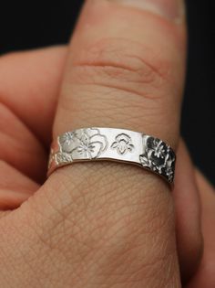 "Copy and paste into your browser, get 15% off ➔ https://bit.ly/VD15OFF Like wildflowers, you must allow yourself to grow in all the places people never thought you would. DETAILS: -Each ring is hand stamped -Ring is 14/20 Gold Filled or Sterling Silver -6mm in thickness You will receive one hand-stamped ring with no enamel filling. **Every item is handmade, this means that each will be unique and may not look EXACTLY like the picture, but it will look very similar ➡ORDER PROBLEMS If there are a Birth Flower Ring, Birth Ring, Allow Yourself To Grow, Violet Design, Impress Art, February Birth Flower, February Birth Flowers, Stamped Ring, Hand Stamped Ring