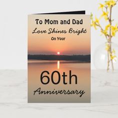 a card with the words, to mom and dad love shines bright on your 60th anniversary