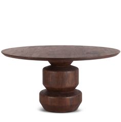 a round wooden table with three pedestals