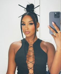 Chun Li Buns Hairstyle, High Bun With Two Strands Out, Chinese Hairstyle Black Women, Bun With Chinese Bangs Black Women, Bangs And Bun Black Women, Ninja Bun With Chopsticks, Hump Hairstyles For Black Women, Bun With Chopsticks Hairstyles, Sleek Back Hairstyles Black Women