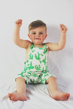 This overall romper is the perfect outfit - great in warmer weather on it's own or in cooler weather layered over a shirt. We make this one out of awesomely soft organic cotton knit with a modern cactus print on it and include gold snaps for the fasteners. It is partially lined on the top. Diaper changes are so easy - just unsnap two snaps and pull the whole thing down. Much easier than snaps at the inseam on a squirmy baby! F A B R I C This romper features 100% organic cotton knit fabric produc Trendy Cotton Overalls For Loungewear, Summer Cotton Green Jumpsuits And Rompers, Cute Green Cotton Jumpsuits And Rompers, Playful Green Cotton Jumpsuits And Rompers, Cotton Onesie For Spring Loungewear, Playful Green Cotton Onesie, Green Cotton Onesie For Spring, Green Summer Onesie For Playwear, Casual Green Onesie For Summer