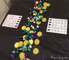 the table is covered with confetti and other decorations for mardi gras