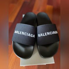 Made In Italy Size 12 Men Balenciaga Pool Slide/Sandals Brand New With Box, 100% Authentic! Designer Slides With Branded Insole For Beach, Designer Beach Slides With Branded Insole, Designer Open Toe Slides For Beach, Designer Beach Slides With Cushioned Footbed, Designer Open Toe Slides With Rubber Sole, Designer Black Flip Flops For Beach, Designer Black Flip Flops For The Beach, Designer Cushioned Beach Sandals, Designer Round Toe Summer Slides