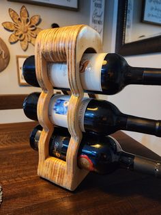 a wine rack made out of wood with several bottles