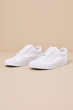 Grab the Vans Old Skool True White Lace-Up Sneakers anytime you want to look casually iconic! Durable canvas fabric and pebbled faux leather come together to shape these must-have kicks with a rounded toe upper and a lace-up vamp with white laces. Signature Sidestripeâ„¢ accents the insole and outsole. Low-cut, padded collar tops a sturdy bumper sole that features the classic waffle outsole! Logo tag at the heel. 1" rubber heel. Cushioned insole. Rubber sole has nonskid markings. Man made materi Casual Leather Canvas Shoes For Streetwear, Casual Leather Canvas Shoes For Spring, Spring Leather Canvas Shoes For Streetwear, Spring Streetwear Leather Canvas Shoes, Classic Vans Canvas Sneakers, Everyday Leather Low-top Canvas Shoes, Leather Canvas Shoes With Rubber Sole For Everyday, White Cotton Vans Canvas Shoes, Urban Vans Sneakers For Spring