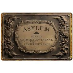 a plaque that says asylum for the criminally insane family entrance