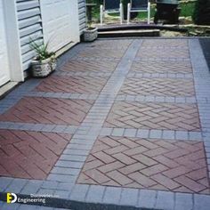 a brick walkway in front of a house