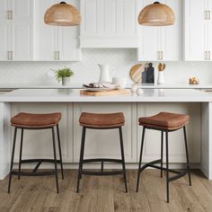 two brown stools sitting on top of a kitchen counter