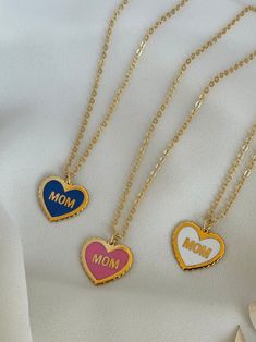 The Word Mom on a heart shape filled with colorful enamel on a beautiful handmade necklace ♥  18k Gold plated  -------------------------- ◦Gift idea suitable for every occasion (Birthday / Anniversary/ Mother's day/ Teacher's day /Christmas) ◦Necklace length 40 cm with 3 cm extra extension ◦Handmade with care and love Product Specifications: ✓Adjustable ✓High quality ✓Handmade ✓Long lasting ✓Unique gift idea All our Products are handmade with care using high quality materials and fine finishing Trendy Gold Plated Charm Necklace For Gift, Blue Enamel Necklace For Anniversary, Trendy Personalized Jewelry For Mother's Day, Trendy Jewelry For Mother's Day Personalized Gift, White Gold Plated Necklaces For Mother's Day, White Gold-plated Necklaces For Mother's Day, Double Heart Enamel Jewelry For Gifts, Cute Jewelry Gift For Mother's Day, Personalized Blue Necklaces For Valentine's Day