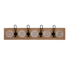 four glass plates are hanging on a wooden rack with black clips and hooks in the shape of circles