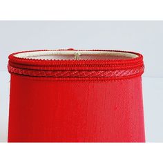 a red lamp shade on a white background