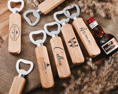 six bottle openers with wooden handles and corkscrews sitting on a blanket