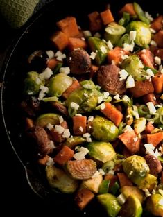 brussel sprouts, brussels sprouts and carrots in a skillet