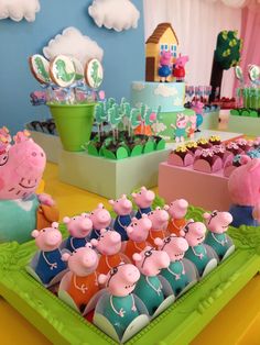 peppa pig themed birthday party with cake and cupcakes