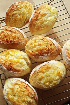 several baked goods sitting on a cooling rack