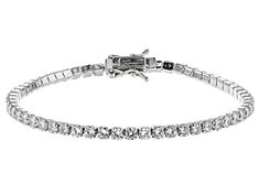 Pre-Owned Bella Luce ® white diamond simulant 9.58ctw round, rhodium over sterling silver bracelet. Measures approximately 7 1/4"L x 1/8"W and has a hidden box closure. The diamond equivalent weight is 6.16ctw..  This product may be a customer return, vendor sample, or on-air display and is not in its originally manufactured condition.  It may not be new.  In some instances, these items are repackaged by JTV. Formal Diamond Bracelet With Sparkling Round Cut Stones, Formal Diamond Bracelet With Sparkling Stones, Sterling Silver Bracelet With Diamond Accents, Formal Sterling Silver Bracelet With Cubic Zirconia, Classic White Gold Bracelet With Sparkling Stones, Sterling Silver Bracelet With Cubic Zirconia For Formal, Classic Sterling Silver Bracelet With Sparkling Stones, Classic White Gold Bracelets With Sparkling Stones, Classic White Gold Jewelry With Sparkling Stones