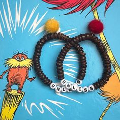 I just adore the Lorax- such a funky little environmentally conscious creature  Brown beads are all-natural coconut beads  Choose your truffula tree (Pom Pom charm) color from the drop-down in 'variations' Pre-made bracelets measure approximately 16cm *If you would like a different size, please leave it (in centimeters) in the personalization section All bracelets are double-threaded on strong and stretchy elastic string, secured with a surgeons knot and E6000 adhesive  Pre-made bracelets measure ~16cm (see last photo for reference) All pre-made bracelets can also be made to custom lengths upon request, as long as they are still in stock Lorax Bracelet, Surgeons Knot, Truffula Tree, Truffula Trees, Pom Pom Charm, The Lorax, Wildlife Conservation, Environmentally Conscious, All Natural