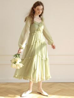 This lightweight dress features drapery, maxi length silhouette. It is accentuated with wide, voluminous ruffled trims throughout.  - Intended for a loose fit- Airy, sheer texture with added lining- Voluminous long sleeves- Two-way styling for off-shoulder silhouette- Smocked back panel with zip closure Spring Flowy Chiffon Dress With Ruffles, Feminine Flowy Ruffled Chiffon Dress, Feminine Flowy Chiffon Dress With Ruffles, Flowy Chiffon Ruffle Dress For Spring, Feminine Maxi Chiffon Dress With Ruffles, Flowy Ruffled Chiffon Maxi Dress, Chic Flowy Chiffon Dress With Ruffles, Spring Chiffon Ruffle Maxi Dress, Elegant Flowy Ruched Ruffle Dress