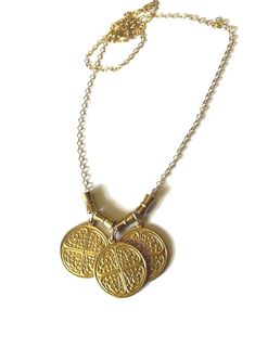 Triple Byzantine Brass Token Necklace with hourglass bead accents on 14K gold-filled chain.  This is a really unique and fun necklace. It has a whimsical charm and is easy to wear with most anything.  Please contact me with any questions. If you require specific measurements, please don't hesitate to ask.  I hope you love your item(s) as much as I loved making it. Please don't hesitate to reach out to me if you have any special requests or alterations. I am happy to make changes to pieces in my store to suit your needs so long as I am capable of doing so. Shipping will take place within approximately 3 business days. All sales are final, HOWEVER, if the item is not as described, has flaws that hinder its functionality or breaks within the first 30 days, I will be happy to repair or replace Bohemian Gold Charm Necklaces For Good Luck, Bohemian Gold Charm Necklace For Good Luck, Brass Byzantine Necklace Perfect For Gifts, Gold Amulet Charm Necklaces For Blessings, Gold Nickel-free Charm Necklaces For Good Luck, Gold Nickel-free Charm Necklace For Good Luck, Gold Brass Necklaces For Blessing, Gold Brass Necklace For Blessing, Gold Good Luck Charm Necklace Nickel Free