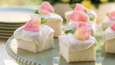 small desserts are sitting on a cake plate