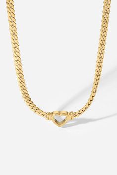 A beautifully crafted gold heart pendant necklace that goes with everything in your wardrobe. Worn alone or layered with other necklaces, this piece is a versatile addition to any outfit. Material: 18K Gold Plated Stainless Steel PVD Color: Gold Style: Pendant Necklace Clasps: Lobster Clasps Necklace Length: 16.73-19.88'' Trendy Gold Plated Heart Necklace With Clavicle Chain, Gold-tone Gold Plated Heart Necklace, Gold-tone Gold-plated Heart Necklace, Gold Choker Necklace For Valentine's Day, Elegant Heart Shaped Chain Necklace For Mother's Day, Trendy Gold-plated Heart Charm Necklace, Elegant Gold Plated Heart Necklace With Chain, Trendy Heart Shaped Necklace With Gold Chain, Chic Heart-shaped Gold-plated Jewelry