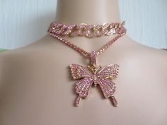 Jewellery set- Iced Out Butterfly necklace set-Statement- Cuban Links Chain Choker-gold plated chain-covered in pink Cubic Zirconia crystals-adjustable to fit Necklace- gold plated and covered with pink Cubic Zirconia crystals- Pendant-gold plated butterfly covered in pink CZ crystals See my shop https://www.Merlinscaveshop.com for more beautiful items. Valentine's Day Gold Rhinestone Jewelry, Pink Pendant Jewelry With Clavicle Chain, Gold Crystal Rhinestone Necklace For Valentine's Day, Pink Gold-plated Jewelry With Adjustable Chain, Pink Gold Plated Jewelry With Adjustable Chain, Pink Cubic Zirconia Clavicle Necklace, Pink Rhinestone Jewelry Set For Party, Valentine's Day Gold Crystal Rhinestone Necklace, Pink Jewelry Sets For Valentine's Day Party