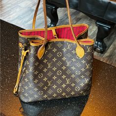 Rare Find Highly Demanded Pre Owned 100% Authentic Louis Vuitton Bag Monogram Mm Interior Cherry Red Canvas Is In Beautiful Condition No Damage No Cracks Straps In Great Condition Interior Is In Good Condition 1 Really Small Ink Spot On The Inside On The Bottom Of The Bag See Pictures Interior Has One Zipper Pocket Zipper Work As It Should No Damage. No Odor Smoke Free / Pet Free Home No Box No Dust Bag Made In Spain Date Code 2014 Serial Number Ca2164 Asking $1500. Obo Motivated Seller I Love T Authentic Louis Vuitton Bags, Red Canvas, Louis Vuitton Neverfull Mm, Neverfull Mm, Find Color, Big Bags, Vuitton Neverfull, Vuitton Bag, Cherry Red