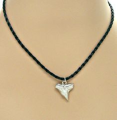 Silver Shark Tooth Necklace 17" to 19" Adjustable Faux Braided Leather Surfer SUP 9000-06 #NecklacePendant #beach #adjustable #surfer #SharkNecklace #sup #MensNecklace #SharkWeek #BoysNecklace #BeachJewelry Shark Tooth Necklace Mens, Shark Teeth Jewelry, Faux Leather Necklace, Necklace Styles, Silver Shark, Boys Necklace, Tooth Pendant, Shark Necklace, Shark Tooth Necklace